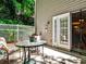Secluded patio with glass-topped table offers peaceful outdoor enjoyment and transitions to the interior space at 1750 Clairmont Rd # 35, Decatur, GA 30033