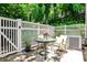 Quaint patio with privacy fence and table, perfect for outdoor dining and relaxing in a secluded setting at 1750 Clairmont Rd # 35, Decatur, GA 30033