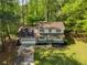 Aerial view of a beautiful home showcasing its lush green lawn and mature trees at 3719 Northbrook Ct, Atlanta, GA 30340