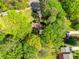Overhead view of home surrounded by lush trees, showcasing the spacious yard and beautiful neighborhood at 3719 Northbrook Ct, Atlanta, GA 30340