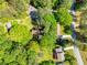 Birds-eye view of home nestled in a lush, green neighborhood featuring mature trees and well-manicured lawns at 3719 Northbrook Ct, Atlanta, GA 30340