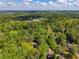 High angle view showcasing a home nestled in a lush green neighborhood with mature trees and vibrant landscaping at 3719 Northbrook Ct, Atlanta, GA 30340