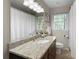 Bathroom featuring granite countertops, a large mirror and neutral decor at 3719 Northbrook Ct, Atlanta, GA 30340