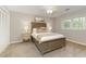 Cozy bedroom features a ceiling fan, large window, and neutral decor at 3719 Northbrook Ct, Atlanta, GA 30340