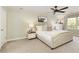 Bright bedroom features a ceiling fan, large window, and neutral decor at 3719 Northbrook Ct, Atlanta, GA 30340