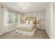 Bedroom with plush carpeting, a ceiling fan, and large window at 3719 Northbrook Ct, Atlanta, GA 30340