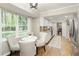 Bright breakfast nook with large windows overlooking the backyard and connecting to kitchen at 3719 Northbrook Ct, Atlanta, GA 30340