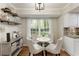 Charming breakfast nook features open shelving and natural light from a large window at 3719 Northbrook Ct, Atlanta, GA 30340