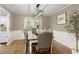 Charming dining room with stylish table and chairs, modern lighting, and a view to the backyard at 3719 Northbrook Ct, Atlanta, GA 30340