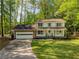 Charming two-story home with a well-manicured lawn and inviting front porch at 3719 Northbrook Ct, Atlanta, GA 30340