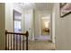 Upstairs hallway connects bedrooms; neutral carpet and paint create a serene atmosphere at 3719 Northbrook Ct, Atlanta, GA 30340