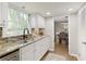Kitchen with granite countertops, stainless sink, and view to the breakfast nook and dining room at 3719 Northbrook Ct, Atlanta, GA 30340