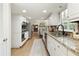 Updated kitchen featuring granite counters, stainless appliances, and a view into the living room at 3719 Northbrook Ct, Atlanta, GA 30340