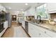 Kitchen features granite counters, stainless appliances, mosaic tile backsplash, and ample cabinet space at 3719 Northbrook Ct, Atlanta, GA 30340