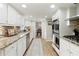 Updated kitchen with stainless appliances, granite countertops, and opens to the breakfast area at 3719 Northbrook Ct, Atlanta, GA 30340