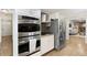 Modern stainless steel appliances including double ovens and gas range offer convenience at 3719 Northbrook Ct, Atlanta, GA 30340