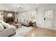 Cozy living room features a brick fireplace, neutral decor, and a large window for natural light at 3719 Northbrook Ct, Atlanta, GA 30340