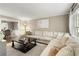 Comfortable living room featuring a large sectional, elegant decor, and an open view to the dining area at 3719 Northbrook Ct, Atlanta, GA 30340