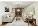 Inviting living room features a brick fireplace, built-in bookshelves, and neutral decor for a cozy atmosphere at 3719 Northbrook Ct, Atlanta, GA 30340