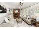 Inviting living room features a brick fireplace, built-in bookshelves, and neutral decor for a cozy atmosphere at 3719 Northbrook Ct, Atlanta, GA 30340