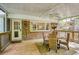 A screened porch with a ceiling fan, wooden deck, and natural light overlooks the backyard at 3719 Northbrook Ct, Atlanta, GA 30340