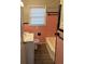 A clean bathroom with a pink tiled wall and modern vanity at 633 Tom Read Dr, Marietta, GA 30062