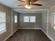 Sunlit dining area featuring new wood floors, a ceiling fan, and neutral color scheme at 633 Tom Read Dr, Marietta, GA 30062