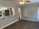 Living room offers wood floors, neutral paint, and an open layout to the modern kitchen at 633 Tom Read Dr, Marietta, GA 30062