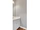 Bathroom featuring a white vanity with a sink, framed mirror, and wood flooring at 3704 Ramsey Sw Cir, Atlanta, GA 30331