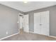 Bedroom with a neutral carpet, gray walls, and a closet door at 3704 Ramsey Sw Cir, Atlanta, GA 30331