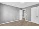 Bedroom with a neutral carpet, gray walls, and a closet door at 3704 Ramsey Sw Cir, Atlanta, GA 30331