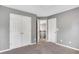 Bedroom with a neutral carpet, gray walls, and a closet door at 3704 Ramsey Sw Cir, Atlanta, GA 30331