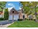 Charming two-story brick home featuring a well-manicured lawn, two-car garage, and a welcoming entrance, perfect for suburban living at 3704 Ramsey Sw Cir, Atlanta, GA 30331