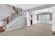 Bright foyer featuring hardwood floors, a staircase with decorative iron railings, and neutral paint create a welcoming atmosphere at 3704 Ramsey Sw Cir, Atlanta, GA 30331