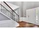 Bright foyer with hardwood floors, staircase and white wainscoting leads into this lovely home at 3704 Ramsey Sw Cir, Atlanta, GA 30331