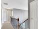 Hallway with wood and iron stair railings at 3704 Ramsey Sw Cir, Atlanta, GA 30331