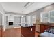 Well-lit kitchen with central island, granite counters, and stainless dishwasher at 3704 Ramsey Sw Cir, Atlanta, GA 30331