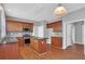 Well-lit kitchen features stainless appliances, tile backsplash, and central island with granite countertops at 3704 Ramsey Sw Cir, Atlanta, GA 30331