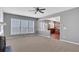 Spacious living room features large windows and an open view into the home's kitchen at 3704 Ramsey Sw Cir, Atlanta, GA 30331