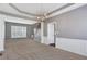 Living room featuring neutral carpet, wainscoting and plenty of light at 3704 Ramsey Sw Cir, Atlanta, GA 30331