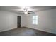 Bedroom featuring neutral carpet and a view to the backyard at 4443 Toonigh Nw Rd, Acworth, GA 30101