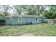 A light blue house with a fenced-in backyard and minimal landscaping needs mowing at 4443 Toonigh Nw Rd, Acworth, GA 30101