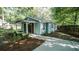 Home featuring a covered front porch, concrete walkway, and side yard landscaping at 4443 Toonigh Nw Rd, Acworth, GA 30101
