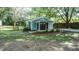 Charming home with a landscaped front yard, fenced area, and mature trees at 4443 Toonigh Nw Rd, Acworth, GA 30101