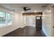 Living room showcasing an exposed beam and three windows for natural light at 4443 Toonigh Nw Rd, Acworth, GA 30101