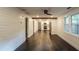 Spacious living room featuring wood floors and an open layout to the updated kitchen at 4443 Toonigh Nw Rd, Acworth, GA 30101