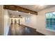 Open concept living room featuring updated kitchen and wood floors at 4443 Toonigh Nw Rd, Acworth, GA 30101