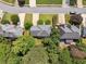 Aerial view of home featuring large trees, nice lawn, a patio and a well maintained roof at 5013 Kendall Nw Sta, Acworth, GA 30102