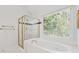 A jacuzzi tub sits under a large window with a leafy view, and a stand-up shower in the corner at 5013 Kendall Nw Sta, Acworth, GA 30102
