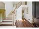 Bright foyer featuring hardwood floors, staircase and white walls at 5013 Kendall Nw Sta, Acworth, GA 30102